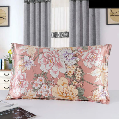 Floral patterned pillow on a bed with curtains in the background