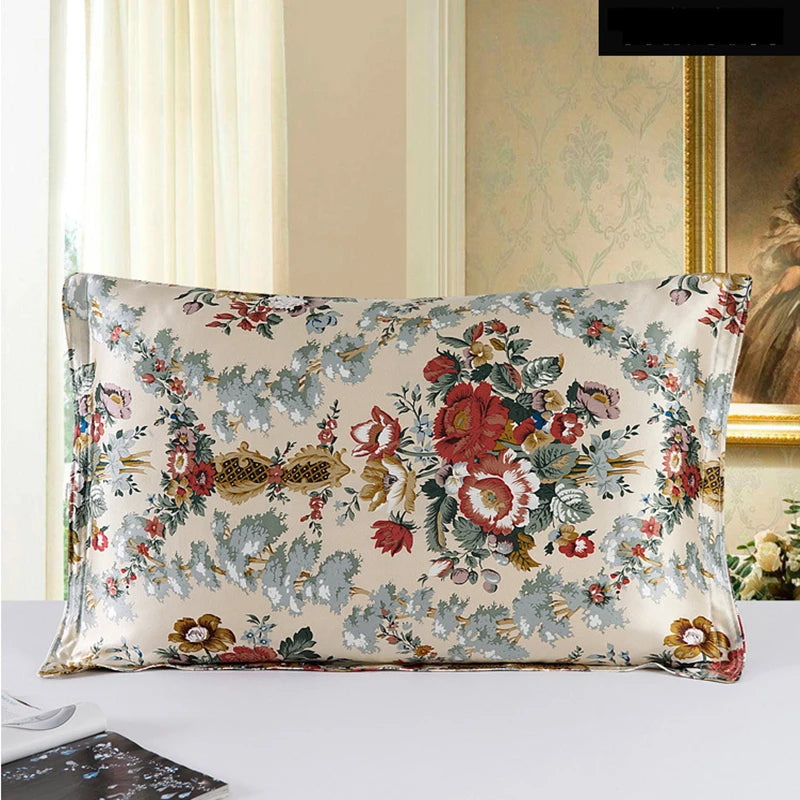 Floral patterned pillow on a bed with a decorative wall in the background