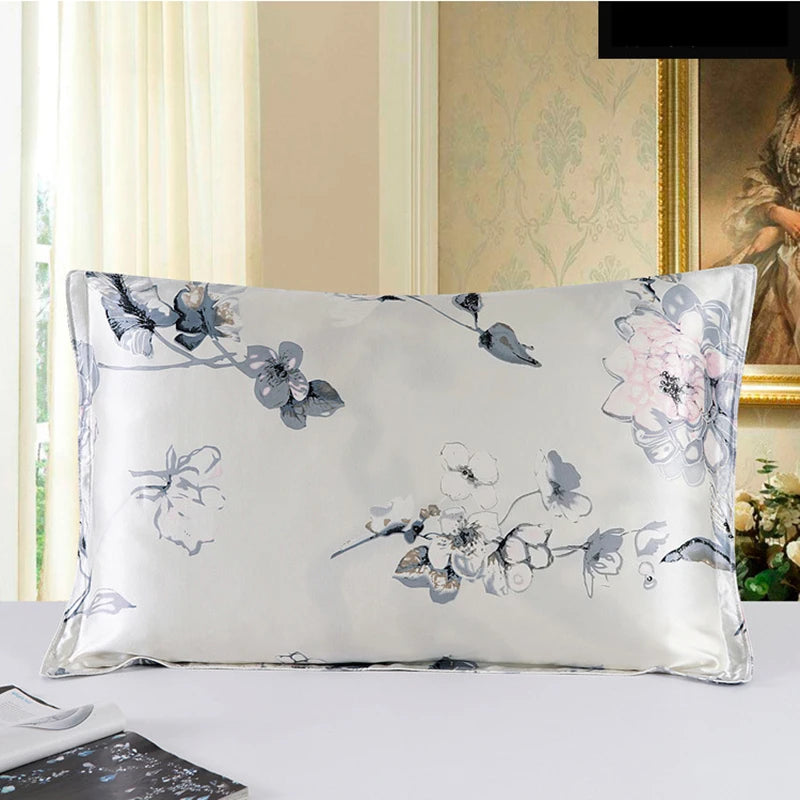 Floral-patterned pillow on a bed with a decorative wall in the background