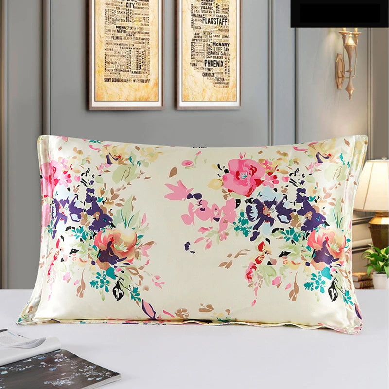 Floral-patterned pillow on a bed with framed artwork in the background