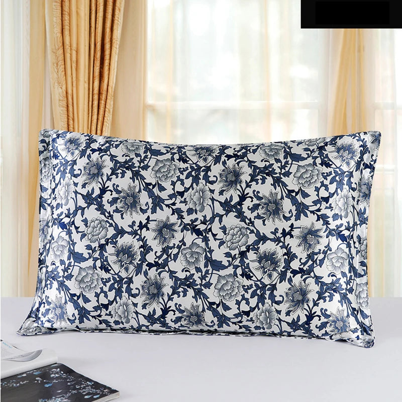 Floral patterned pillow on a bed with curtains in the background