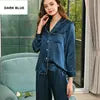 Woman wearing a denim outfit with a blurred background