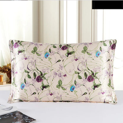 Floral patterned pillow on a bed with a neutral background
