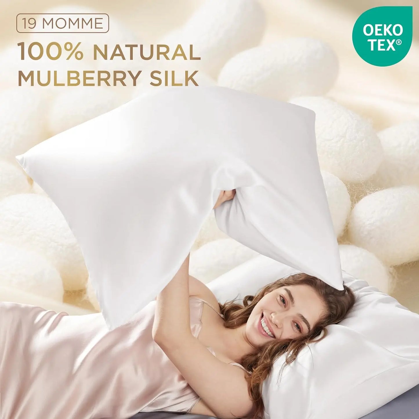 Woman lying on a bed with white pillows, surrounded by mulberry silk fibers, with '19 Momme 100% Natural Mulberry Silk' text and Oeko-Tex logo.