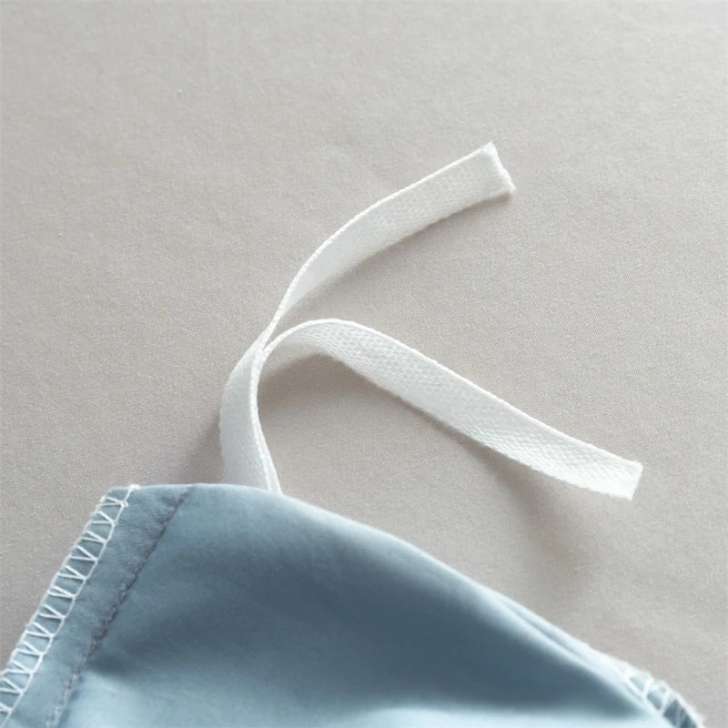 Light blue fabric with white straps on a gray background
