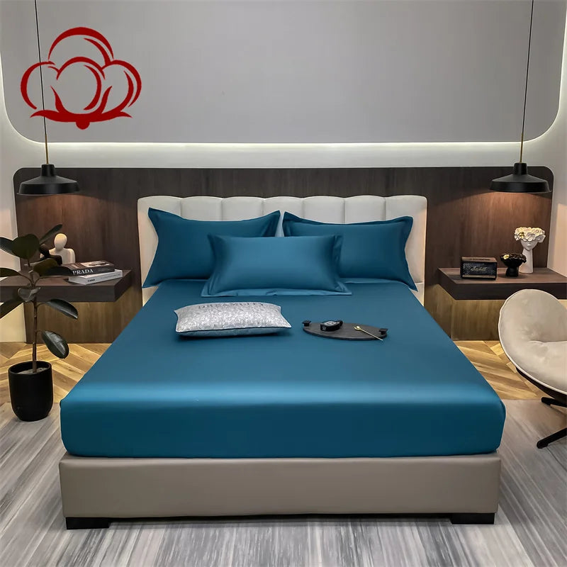 Bedroom with blue bedding and a modern headboard