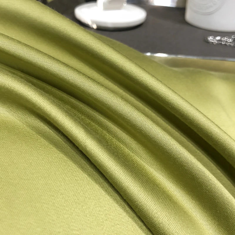 Close-up of green fabric with a blurred background