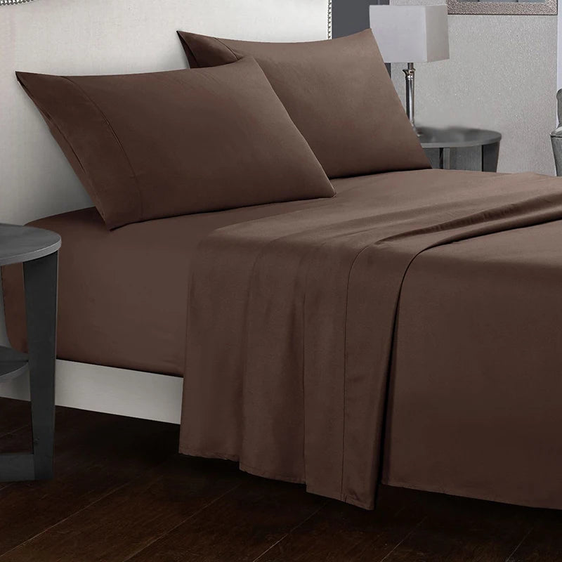 Brown bed sheets and pillows on a bed in a bedroom setting.
